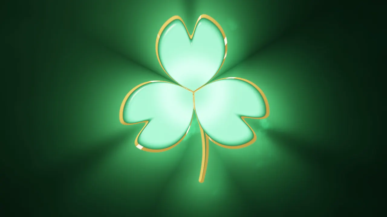 A shamrock of thick emerald glass with gold rims on velvet